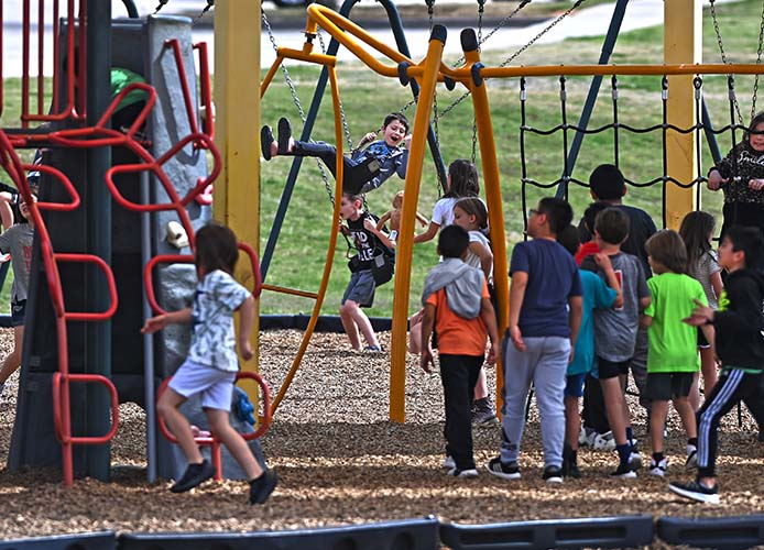 chidren playing on a playground